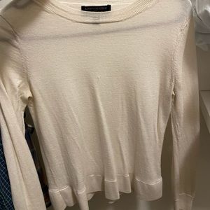 Merino wool sweaters, one black, one cream